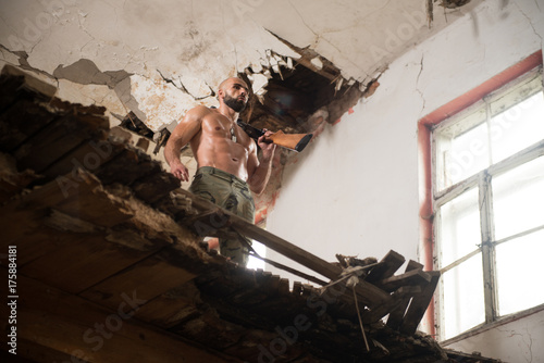 Confident Man Portrait With Machine Gun © Jale Ibrak