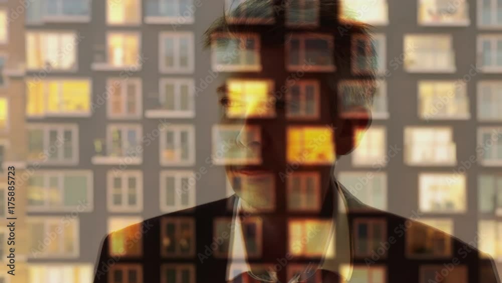 Reflection of a businessman looking through a window Reflection of a businessman looking through a window