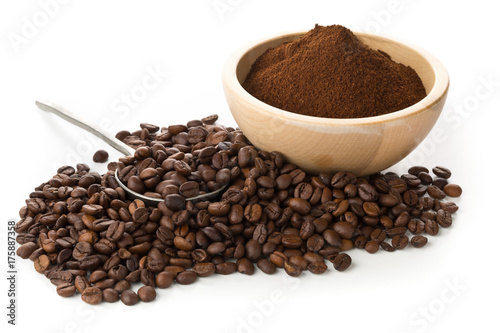 Coffee beans with ground coffee in wooden bowl