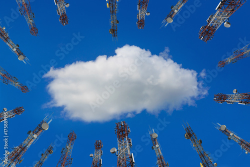 Antenna of cellular cell phone and communication system tower with cloud on center blue sky, Telecommunication tower perspective. technology concept. photo