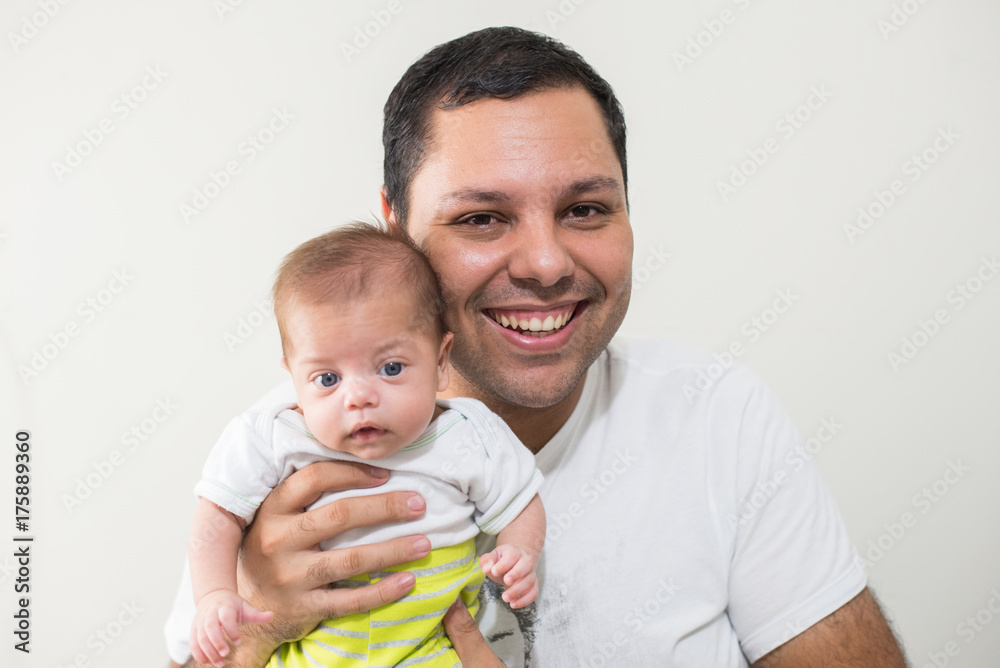 Father holding blue eyed baby - Side by side Father holding blue eyed baby - Side by side