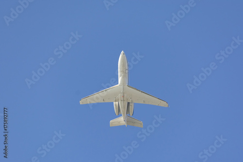 private jet airplane on blue sky composition photography