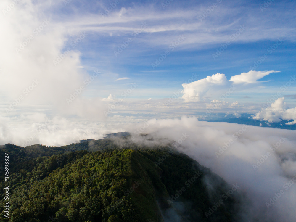 Top of mountain with view into misty valley. Foggy valley mountain view. Beautiful nature.