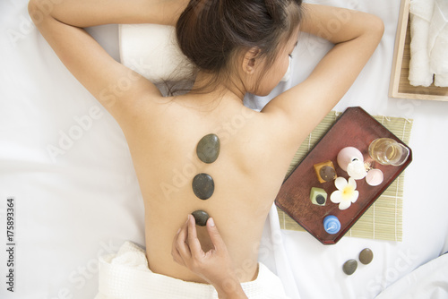 Spa concept.Stone Massage on back relaxation for beautiful woman.
