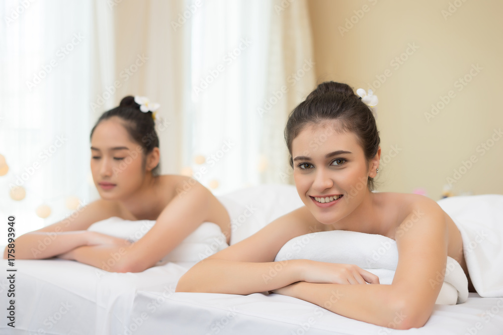 Two cute young women during a skin care treatment at a spa. Two cute young women during a skin care treatment at a spa.