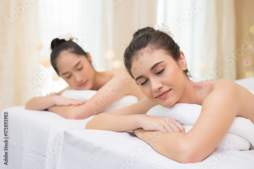 Two cute young women during a skin care treatment at a spa.