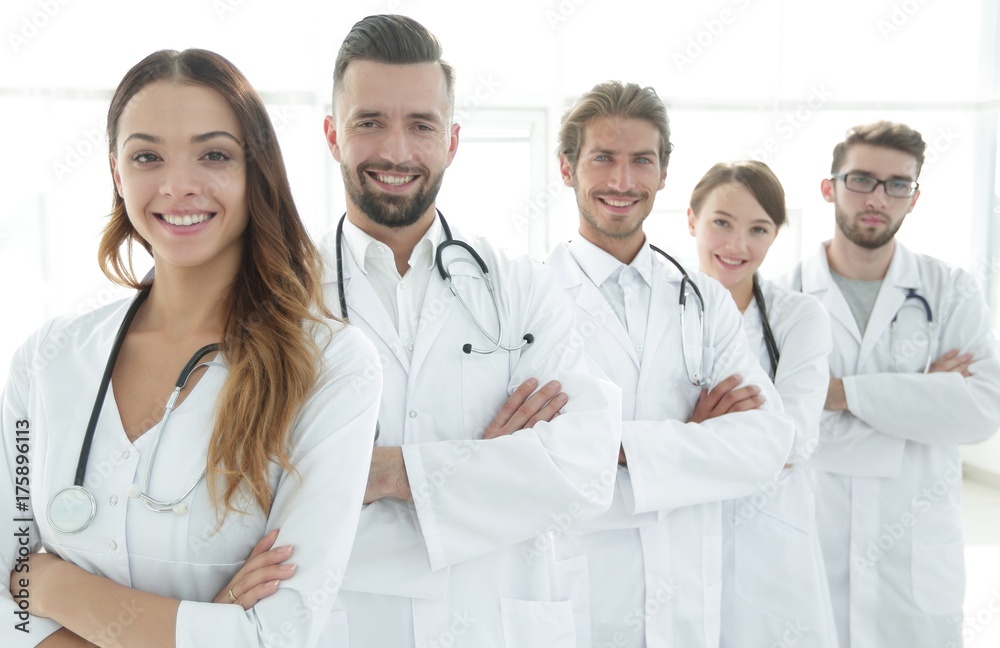 Portrait of medical team standing with arms crossed in hospital Portrait of medical team standing with arms crossed in hospital