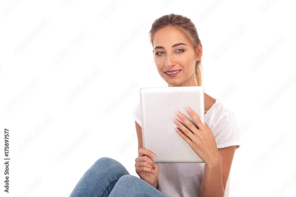 happy casual woman with tablet sitting