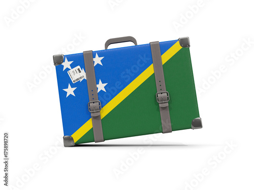 Luggage with flag of solomon islands. Suitcase isolated on white