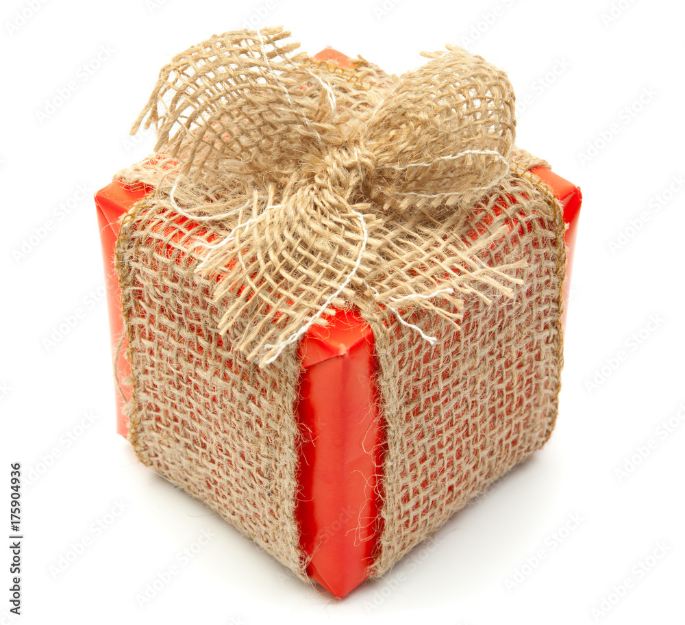 Natural Looking Christmas Gift, wrapped in red paper , with Jute Ribbon - Isolated on white Cut Out