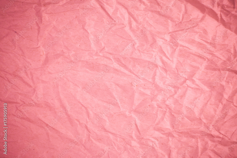 Crumpled recycle pink paper background.