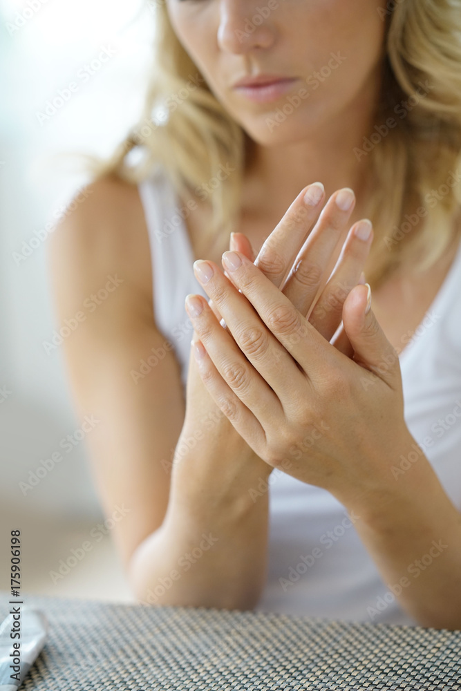 Closeup on woman's hands applying moisturizing hand-cream on Closeup on woman's hands applying moisturizing hand-cream on