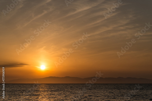 Beautiful sunset with clouds and sea. © Vladimir Arndt