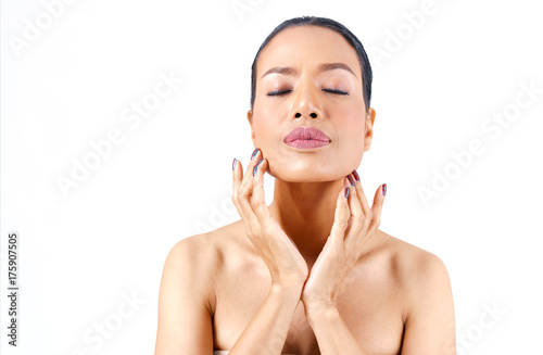 Close up beautiful middle age Asian woman's face hands touching her chin isolated on white background , beauty concept