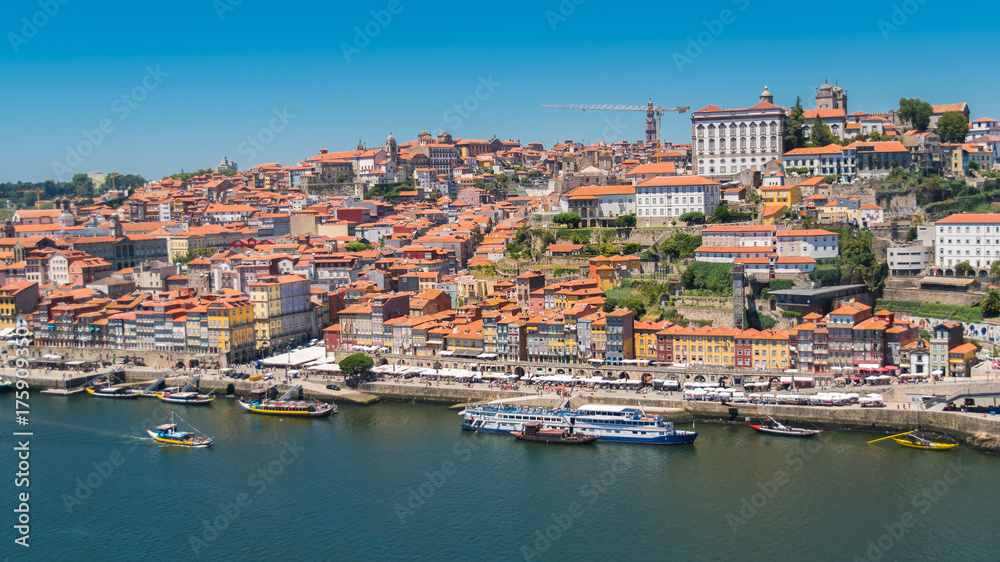 Orange tiles roofs in Porto, Portugal, panorama with typical houses on the hill
