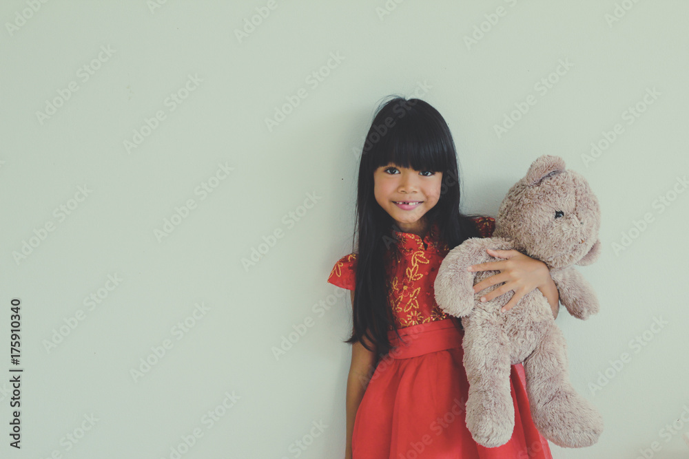 A Cute Asian Kid Girl Holding Big Teddy Bear Wearing Red Chinese Dress For Chinese New Year Stock Photo Adobe Stock