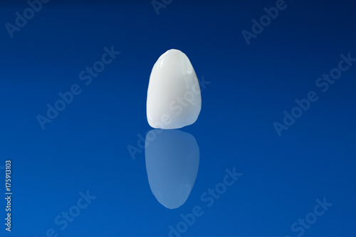 Ceramic crown on blue background