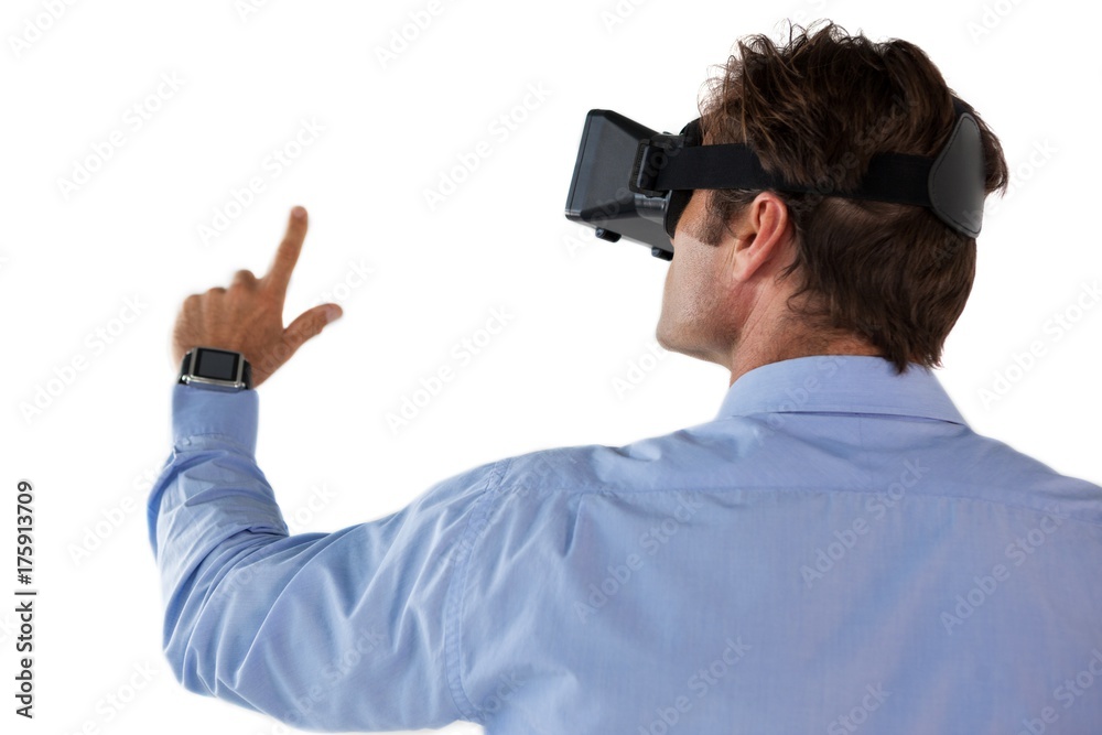 Rear view of businessman gesturing while using vr glasses Rear view of businessman gesturing while using vr glasses