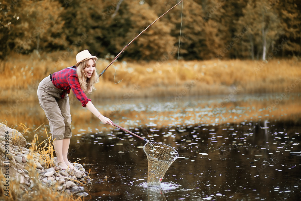Girl in autumn with a fishing rod Girl in autumn with a fishing rod