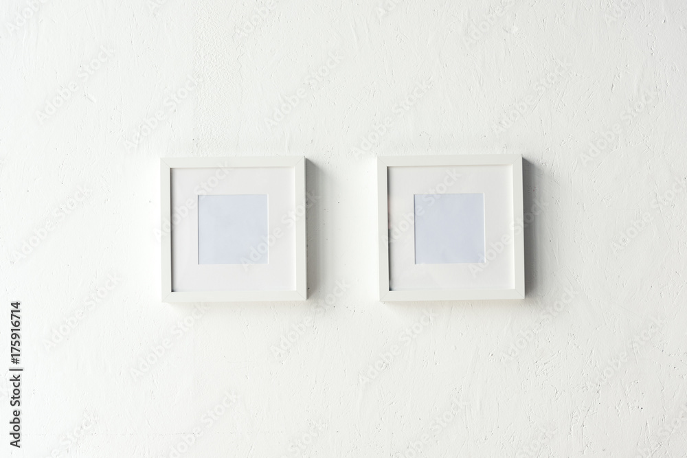 empty photo frames hanging on wall empty photo frames hanging on wall