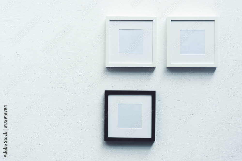 empty photo frames hanging on wall empty photo frames hanging on wall