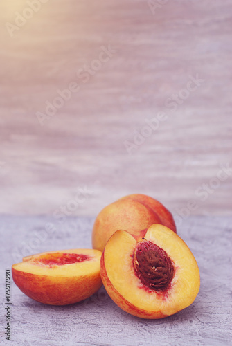 Peach or Nectarine fruit isolated on rustic gray toned background
