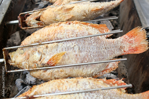 Thai Salt Crusted Grilled Fish /Salt baked fish on street food Thailand
