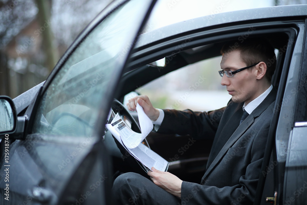 Man in a business suit in the car Man in a business suit in the car
