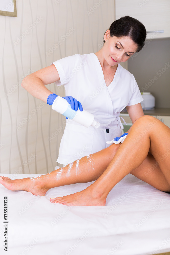 Fototapeta premium Woman cosmetologist in a spa salon