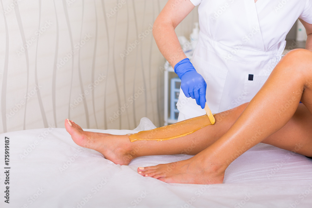 Fototapeta premium Woman cosmetologist in a spa salon