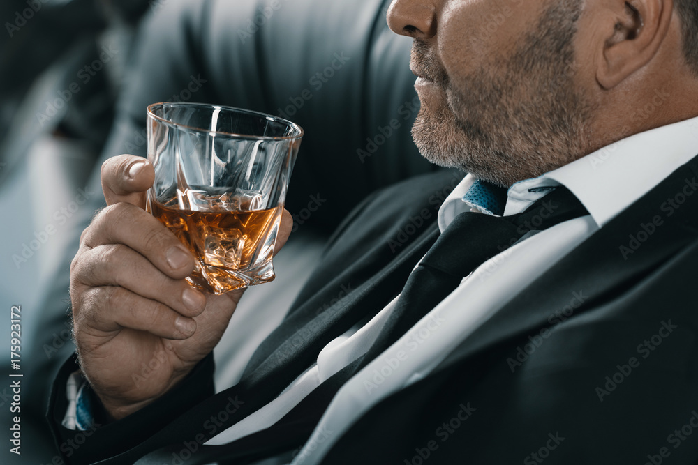 businessman with glass of whiskey businessman with glass of whiskey