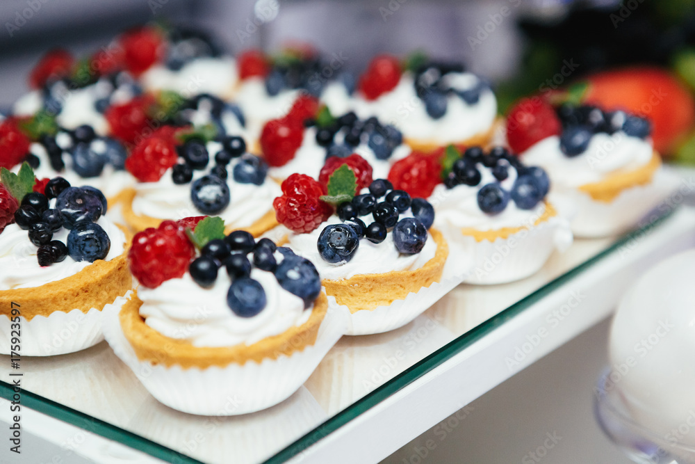 Baked baskets with cream and berries Baked baskets with cream and berries