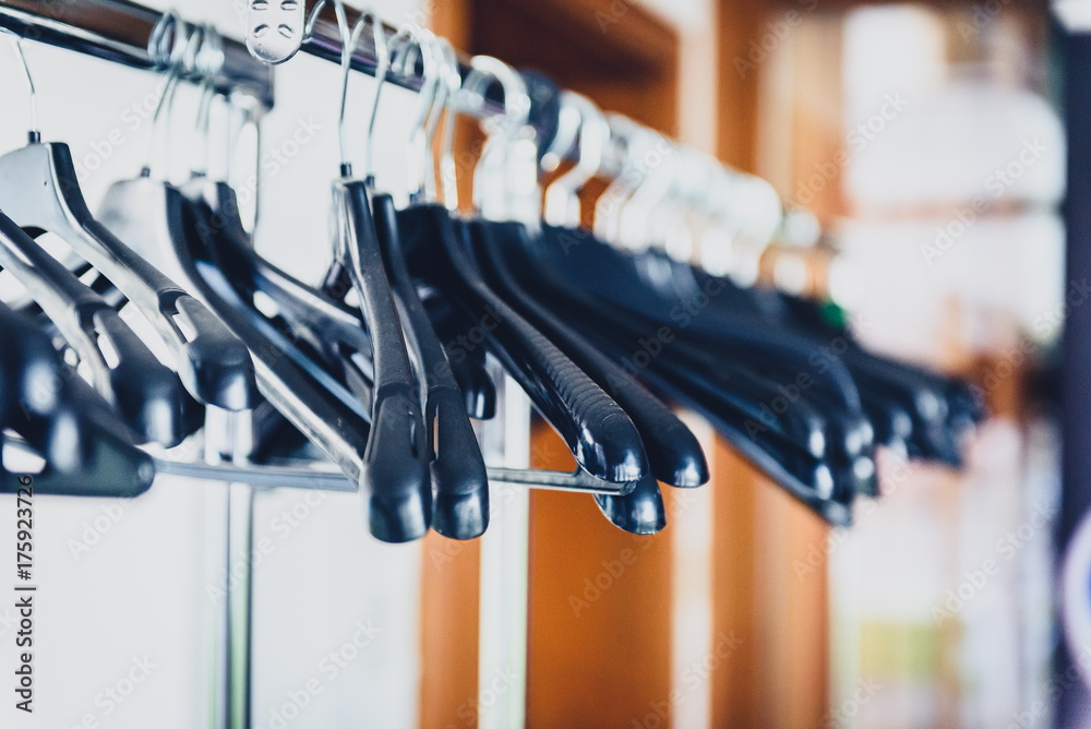 Empty wardrobe stand with black hangers at business event venue. Empty wardrobe stand with black hangers at business event venue.