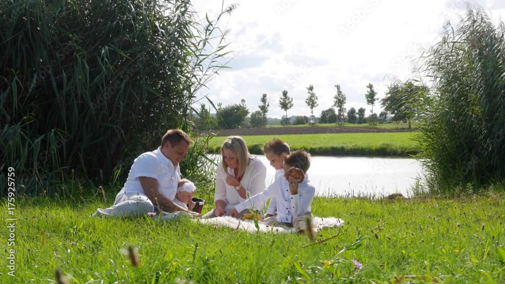 Family doing a picnic on the lawn Family doing a picnic on the lawn