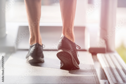 man in sportswear running on treadmill at gym © fotoinfot