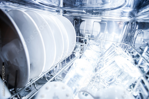 Fényképezés Interior of dishwasher machine with clean dishes
