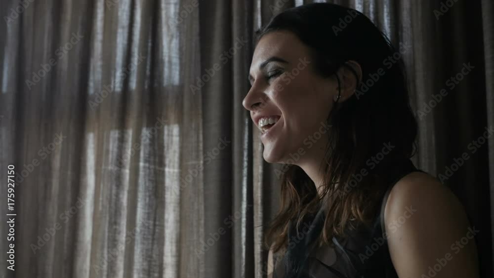 Smiling woman near window Smiling woman near window