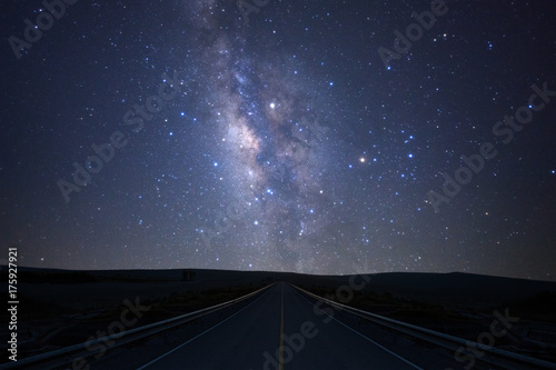 The milky way galaxy over the road with stars and space dust in the universe