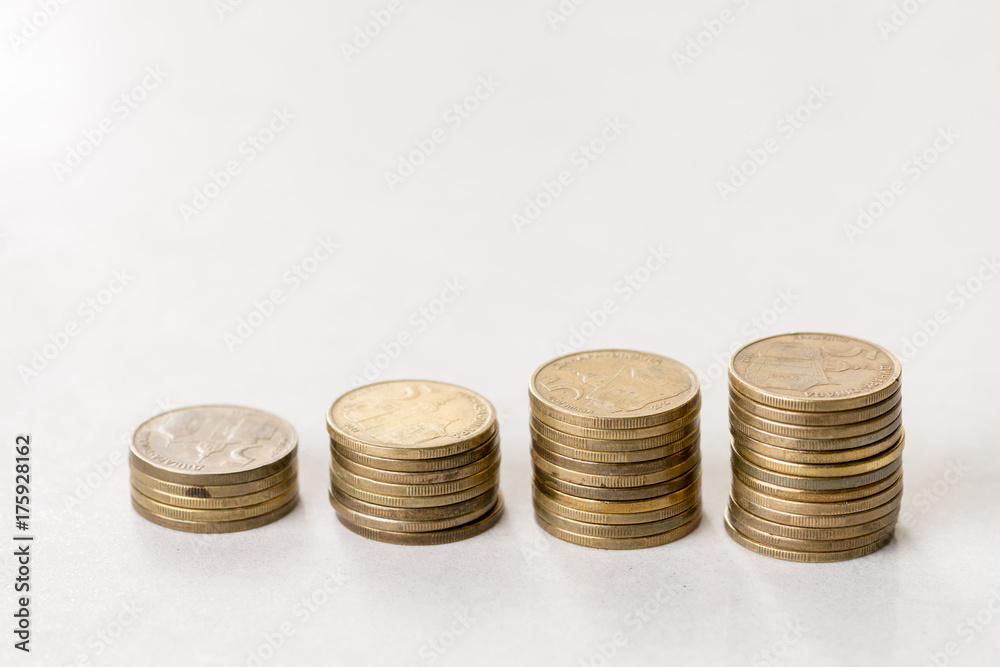 Stock steps of metal coins isolated over white background Stock steps of metal coins isolated over white background