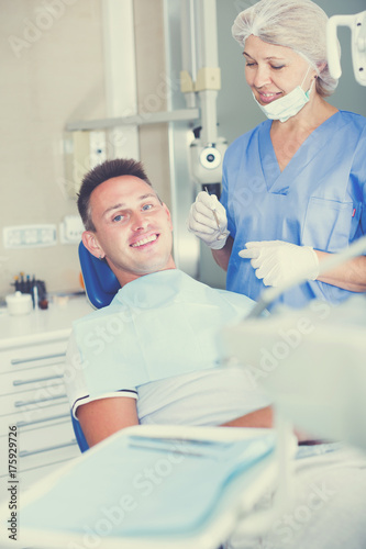 Man in dental chair waiting for examination