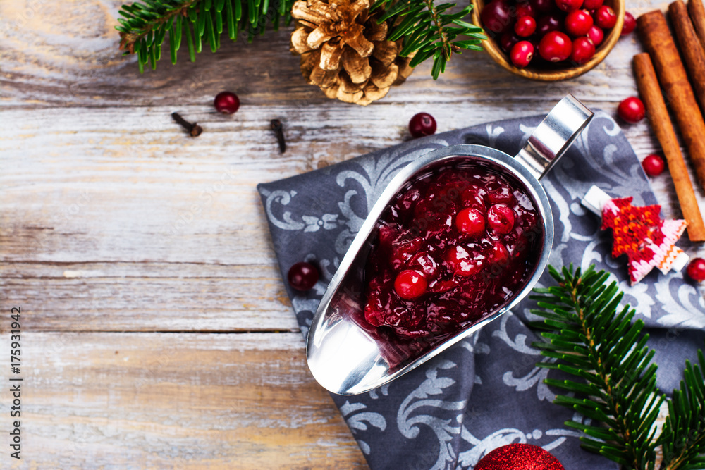 Cranberry sauce in a stainless steel sauce pan on festive christmas