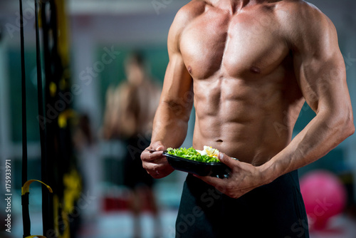guy eating salad gym fitness