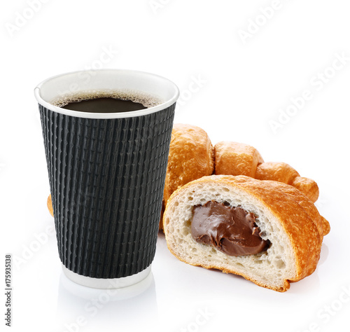 Croissant and coffee in paper cup isolated on white background.