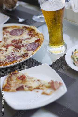 Delicious pizza on table in cafe