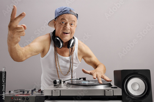 Elderly DJ making a peace sign