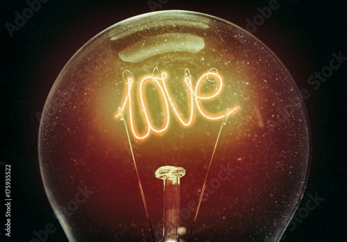 The concept of love. Filament light bulb in the shape of the word love. An excellent choice for the design of postcards.