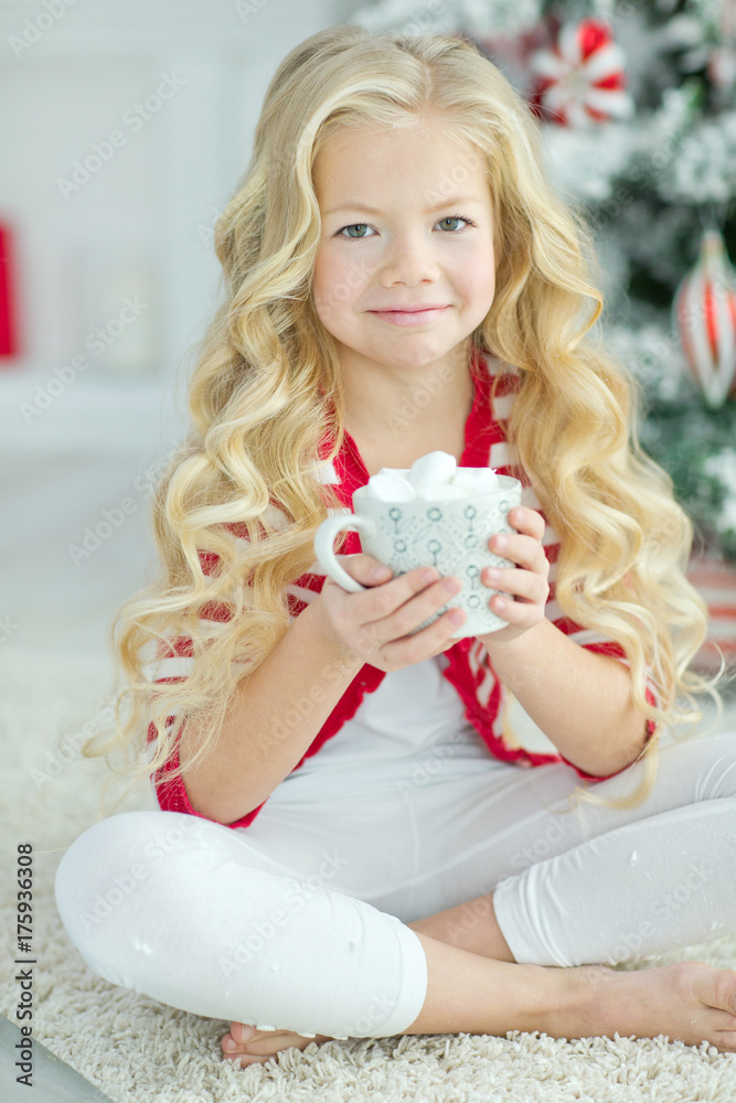 A child at Christmas with a mug  