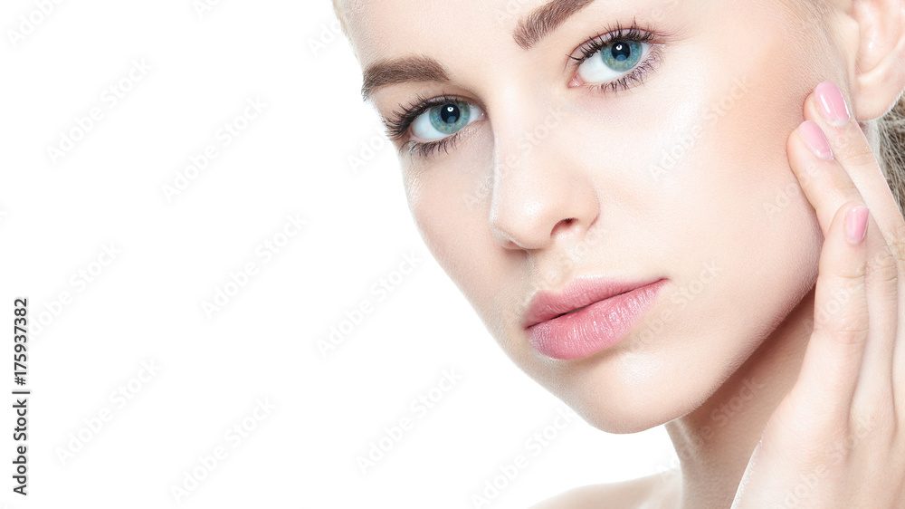 Beautiful Young Blond Woman with Perfect Skin touching her face. Facial treatment. Cosmetology, beauty and spa concept. Isolated on white background. Beautiful Young Blond Woman with Perfect Skin touching her face. Facial treatment. Cosmetology, beauty and spa concept. Isolated on white background.