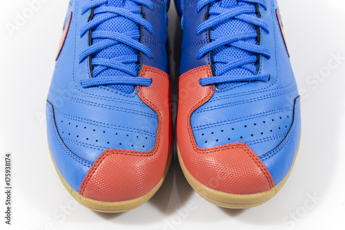 Male blue and red leather sneaker on white background.