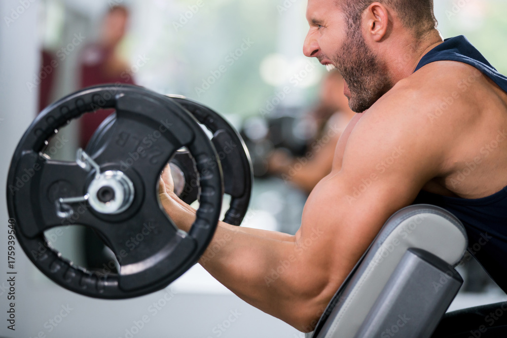 Man lifting weights, training, gym